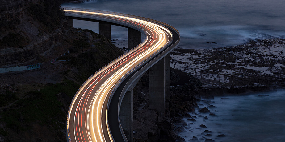 Car light trails on bridge