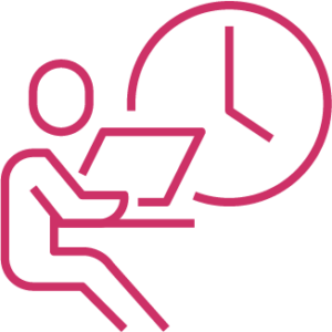 Working on laptop with clock